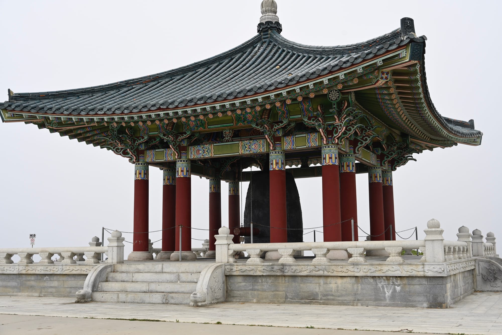 The Korean Bell of Friendship Pavilion in San Pedro, with red columns and an ornate traditional Korean roof