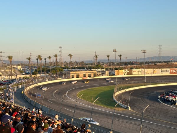 Cars race at Irwindale Speedway during the Night of Destruction event.